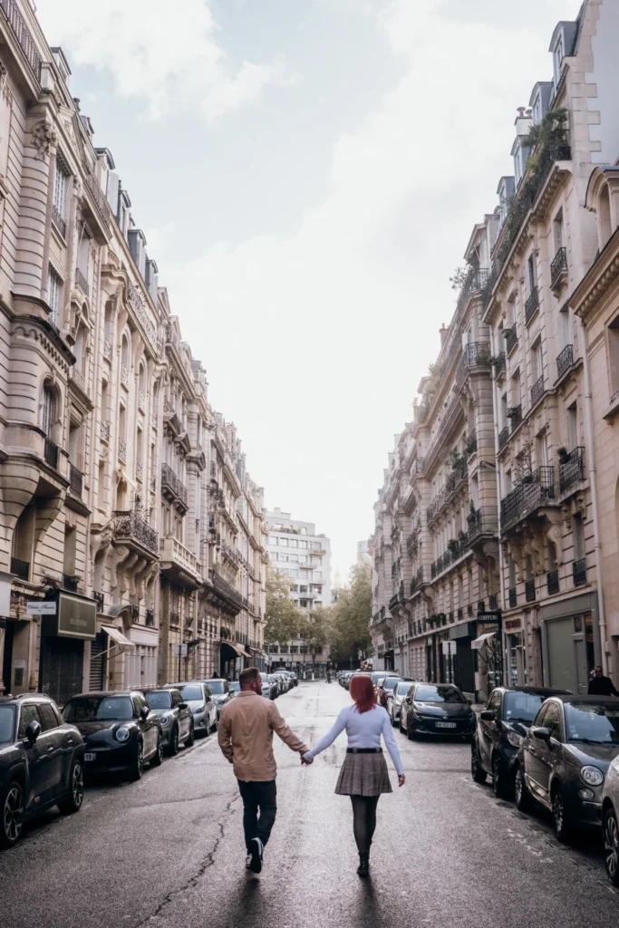 couple holding hands in Paris