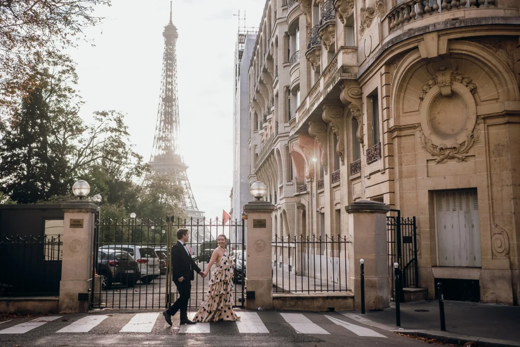 Couple holding hands in Paris