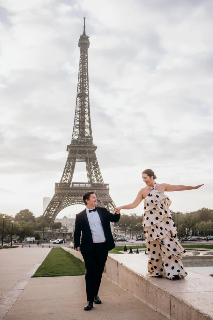 Couple having fun in front of the Eiffel Tower