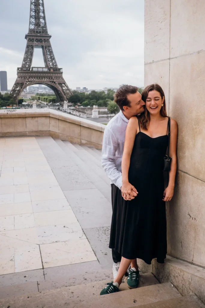 Couple kissing with the Eiffel Tower in the background